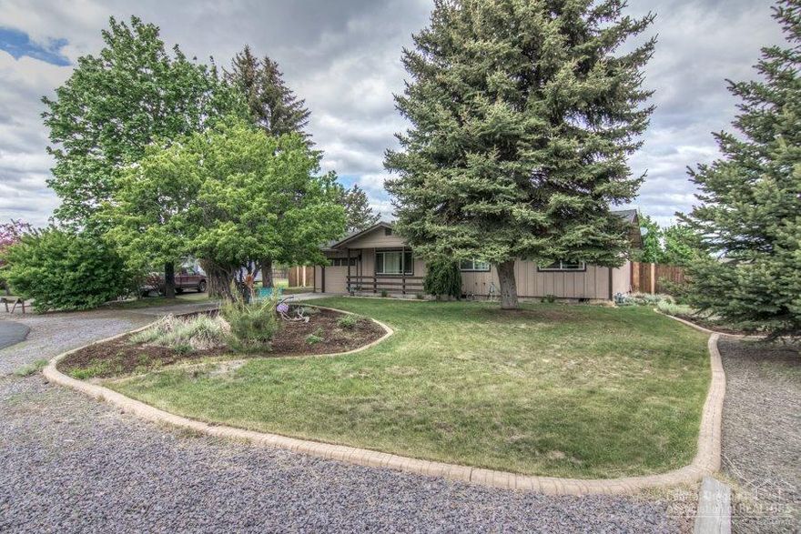 Adorable single level ranch home on almost half an acre with lots of RV & boat parking. Extra elbow room & privacy in this well maintained home. Open living room w/gas stove, hardwood flooring in the kitchen & dining area. Beautiful alder interior doors & wood trim, updated bathroom, newer vinyl window, gas water heater. You'll enjoy entertaining & BBQ's in the huge fenced backyard. New septic tank installed 3/2016. Close to schools & within a few miles of downtown Bend. Come preview today!