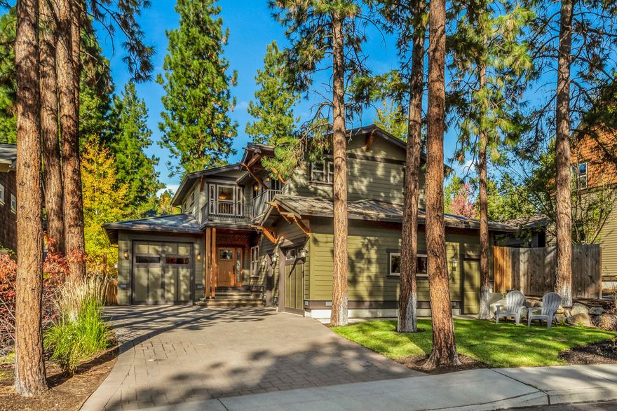 Rich in detail and classic finishes, this distinctive Valhalla Heights home, built by Cloninger Custom Homes, provides proximity to all that Bend's Westside has to offer. Custom ironwork railings, beautiful slate floors & thoughtfully designed cabinetry are abundant in this 2,436 SF, 4 bedroom home.  An open living area flows from the well-appointed kitchen with granite counters, breakfast bar, pantry & plentiful cabinets to an inviting living space with gas fireplace, slate hearth & custom built-ins. Enjoy seamless access to the private, fully fenced backyard with large paver patio surrounded by a low brick wall & majestic evergreens.  Bedroom/den & charming dining space complete the main floor. Upstairs, 4 bedrooms & 2 baths, including primary suite with small private balcony, walk-in closet, & large bath with dual head stone shower. Paver driveway leads to separate garages, 1 adventure van space & another oversized 2 car gar. with loads of gear storage. Don't miss this one!