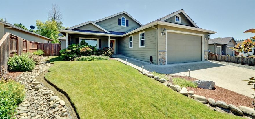 The location of this beautiful home is outstanding. Tucked away at the back of a cul-de-sac in a newer subdivision in SW Grants Pass. Built in 2005; 3 bedrooms and 2 full baths with 1959 sf. Spacious and open floor plan that is highly desirable with attention to details and upgrades galore. Hardwood floors in the entry and kitchen area, designer color scheme and accent lighting throughout. The kitchen has granite counter tops and center island , plenty of cabinets and a extra sink for a kitchen helper. The living room is the heart of the home with a cozy fireplace and an exit door to a private covered patio. The Master is in the back of home with a his and her vanity and closets, tub and separate shower. The landscaping front and back are dialed in and well thought out. RV parking for a bus behind a gate is on the list as well. Come and check it out!