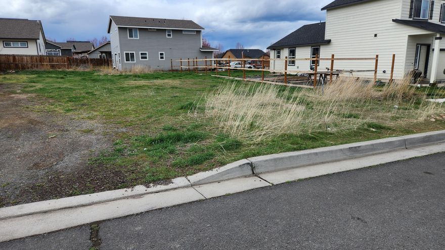 One of the few lots available in the desirable development of Morning Crest Estates.  This level lot has the utilities located in street.  There are existing houses on either side of this lot.  The location is close to the hospital, Mosaic Medical Center, schools and the Madras aquatic center with trails in the area.