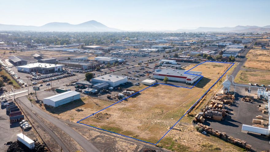 Area behind Staples, Schucks Auto Parts, and Crossing the Jordan Thrift Store. Flat Commercial Property with access off Washburn Way and Crosby. Multi-zone, high industrial and a general commercial.