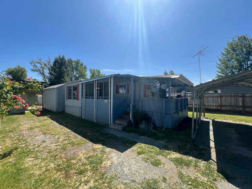 Mobile Home on rented land, located on a quiet, well-maintained property just minutes from the beautiful Rogue River. Situated on one of the nicest lots on the property, the home offers added privacy set back from the main road. The space rent is $400/month and includes water, sewer, and garbage services. A bit of TLC will make this home shine! Features include a covered carport, and a storage shed for added convenience.