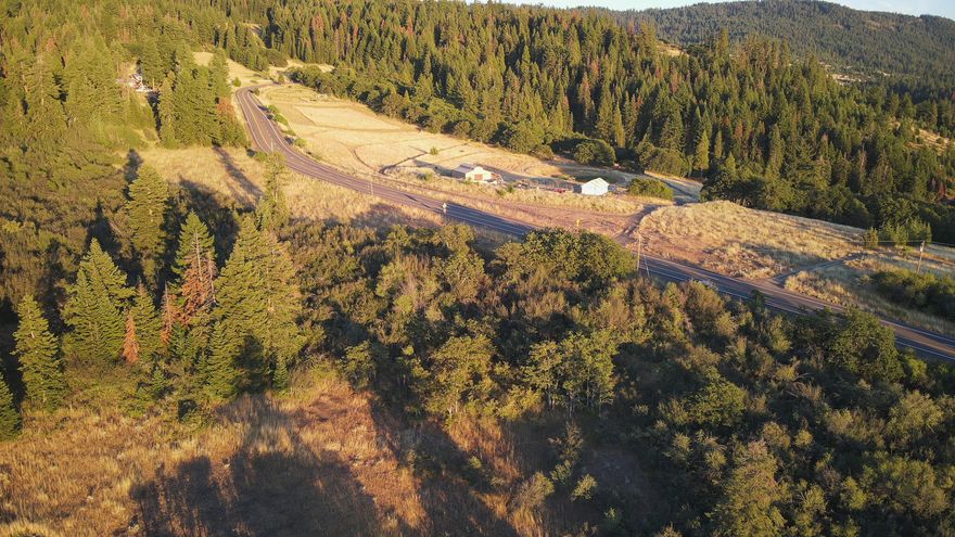 Premium building lot above the fog! This property sits directly north of Hooper Springs Park with easy access from Dead Indian Memorial Road. Gently sloping lot toward the west with a mixture of hardwoods and conifer trees that allows for privacy while still maintaining great views! Home site and septic have already been approved. A great spot to park an RV and enjoy the sunset or build that custom home you've been dreaming of. Manufactured homes are okay as well. Call today!