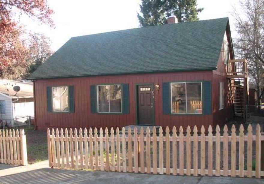 This is a fixer, but looks GREAT at a GREAT price! This property consists of a 4 bedroom, 2 bath home on the main floor with one bedroom upstairs; a studio apartment with outside access upstairs. The main house has an area at the back of the home that was used by the prior owner as a third unit; however, it is legally a duplex. The back part of the home needs to be completed, and could be a family room with the 4th bedroom, a small kitchenette area and the second bathroom. The studio apartment upstairs with its own outside access is a perfect rental to supplement income should one decide to occupy the main house. There is a 2 car carport at the back of the property with alley access. Fresh interior and exterior paint, new flooring, new lighting fixtures...the property has been cleaned up and is ready for the next level of improvement! All info is deemed reliable but not verified, anyone considering the purchase of this property should perform their own investigation.