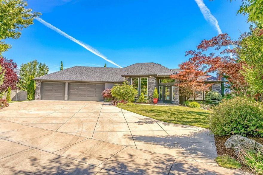 Custom built by the Mahar Brothers in 2004, this home is stunning inside and out! An entertainer's dream home. Beautiful windows and a flying deck highlight the Rogue Valley. Spacious master suite on main level has large walk-in shower, jetted tub, double sink vanity & walk-in closet. Oversized kitchen offers granite counters, island w/eating bar, stainless steel appliances including convection wall oven, gas cooktop, dishwasher, trash compactor and custom cabinetry. In the lower walkout finished basement the surprises continue: wet bar with concrete countertop, dishwasher, refrigerator, pool table, high tech sound system and power reclining seats in the theater room. A 950 sqft game rm could be a 4th BR. Spacious backyard provides privacy, and a place to run around. Backyard is fully fenced, landscaped, and includes a gas fire pit plus a brand new hot tub. Oversized 3 car garage w/pull-down ladder to attic storage. Established neighborhood, and mature landscape. A definite must see.