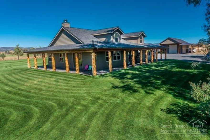 Rare find. 20 acres irrigated currently in alfalfa. McKay creek runs through the property. Beautiful western style home was completely remodeled in 2005. Wrap around country porch with log accents, paver patio, beautiful tile work, wood ceilings, spacious master suite with tiled steam shower, huge shop, finished, insulated, heated, 220 power, guest quarters, tack room with shed roof for additional covered parking.
