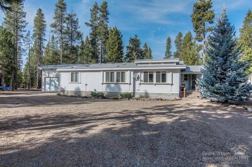 Wonderful home, amazing acreage! Beautiful 2,188 sq/ft manufactured home on 10 pristine, private acres. Immaculate, well cared for home w/spacious, open floor plan. Light & bright! Double garage attached by breezeway. Fantastic, 40 x 60 outbuilding w/separate work shop, lots of room for RV s & tons of storage. Property is adjacent to Wagon Trail Ranch & backs to public lands. Drive your ATV or ride your horse right off the property and enjoy acres of open public land. Close to Mt. Bachelor & La Pine.