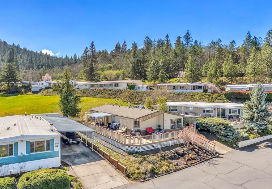 Come for the view, stay for the country feel! The perfect combination of comfort and convenience awaits you with this incredible home nestled just outside the city. Enjoy a cup of coffee in your open and full of light living room surrounded by views of the city or relax in your backyard with a country feel. Either way, you'll love this move-in-ready and well-maintained home with a ton to offer. Other noted features: Carport, Detached storage Shed, Large partially covered deck, 3 bedrooms, 2 baths | Family + Living Room, 1,566 sq ft., 55+ community.