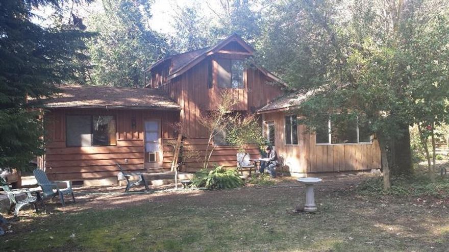 Unique Rustic home and outbuildings consisting of garage. shop, and large pole barn big enough to house your RV and your live stock! This quaint home needs finishing touches,one room is framed in but not finished could be 3rd bdrm or office. and the kitchen needs re modeling. BUT, the whole package is breath taking. Drive up and see the possibilities. Is this one of a kind property your Oregon Dream?