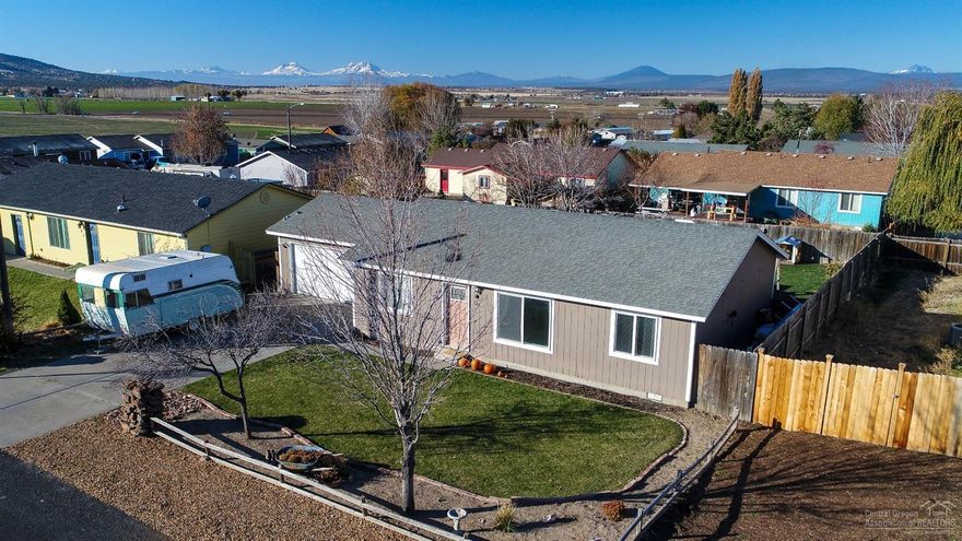 Well taken care of home with functional floor plan. Convenient location close to schools and park.Must see huge, fenced backyard with mountain views! Updated kitchen with all new cabinets, counter tops, fixtures and laminate flooring. Large custom red wood deck, perfect for entertaining! Plenty of room for parking. Great value wont last!!!!