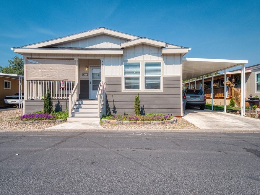 This Lovely 4 year old home boasts of vaulted ceilings, a beautiful kitchen with a farmhouse stainless steel sink, a wall mounted pot filler over stove and bright sunny dining area. Lots of windows that are double-pane and bring in lovely light. The open floor plan is perfect for entertaining and family fun. The laundry is conveniently located down the hall & accommodates a side-by-side that leads to easy access to the carport, sunny backyard and storage sheds for all of your gardening tools or storage needs. The home has a primary bedroom with an on suite bath, two additional bedrooms, and a full bathroom. The land lease is $635.00 per month at Medford Estates...with a country-like setting, minutes from shopping, entertainment, and schools. Access to a clubhouse, new playground, basketball court, planned resident activities, and more are included.