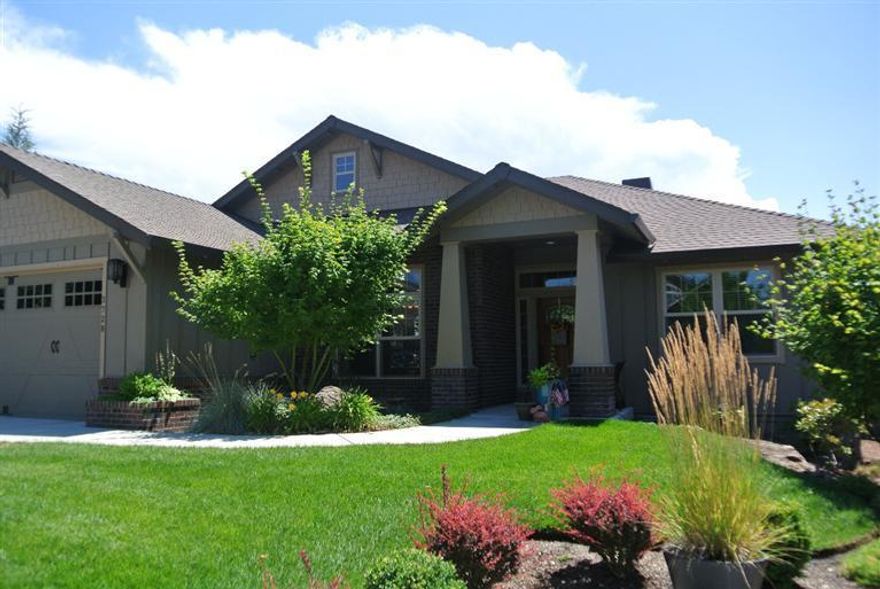 light and bright,welcoming and warm... This single level, split floor plan home is one of those I gotta live here houses. Lots of windows, high ceilings, hardwood floors, tile and granite. master bedroom and bath are on one side of the home with 2 bedrooms and bath on the other. Large dining room could be sitting room or office/den. built in temperature controlled wine storage, custom built cabinets on either side of the fireplace and custom built pantry. the garage is over sized with workshop area or extra storage.