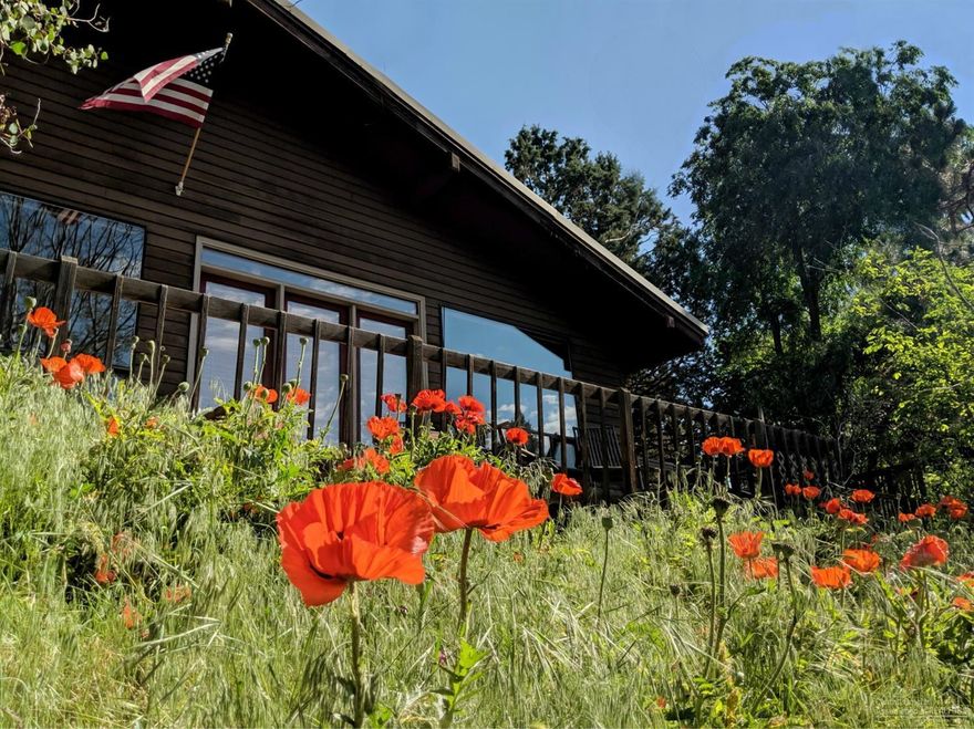 This inviting home on Bend's west side is just 2 blocks from the First Street Rapids, on a dead end street in highly sought after Aubrey Heights. The single level, 2 bedroom/1 bath home is perched on the uphill side of Utica Avenue and features a passive solar design by Wright Design Studio. The open floor plan, vaulted ceilings, and large windows create a living space that is bright and welcoming. There is plenty of yard space perfect for raised beds, paver patios or anything you can dream up. Enjoy the view of Pilot Butte from the front deck and find yourself surrounded by aspen, juniper, and ponderosa pines. With easy access to the river, trails and parks as well as the convenient distance to downtown, this location is hard to beat.