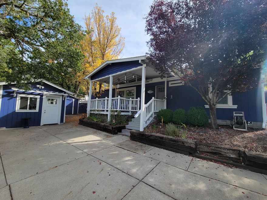 Here is your chance to own a beautiful house in Shady Cove.  Inside is a nice open floorplan with master bedroom to the left and two other bedrooms on the right.  Kitchen has granite counter tops and matching appliances. The covered front porch is a great place to relax and watch the deer and if you're wanting a bit more privacy there is a new deck in the backyard.  Up some stairs a gazebo with an amazing view.  The house is set back away from the street. The backyard is terraced and has plenty of room for a garden.  Artist studio with power to let your creative side flourish as well as storage shed. A two car garage allows for ample parking.  RV parking and more! Motivated seller
