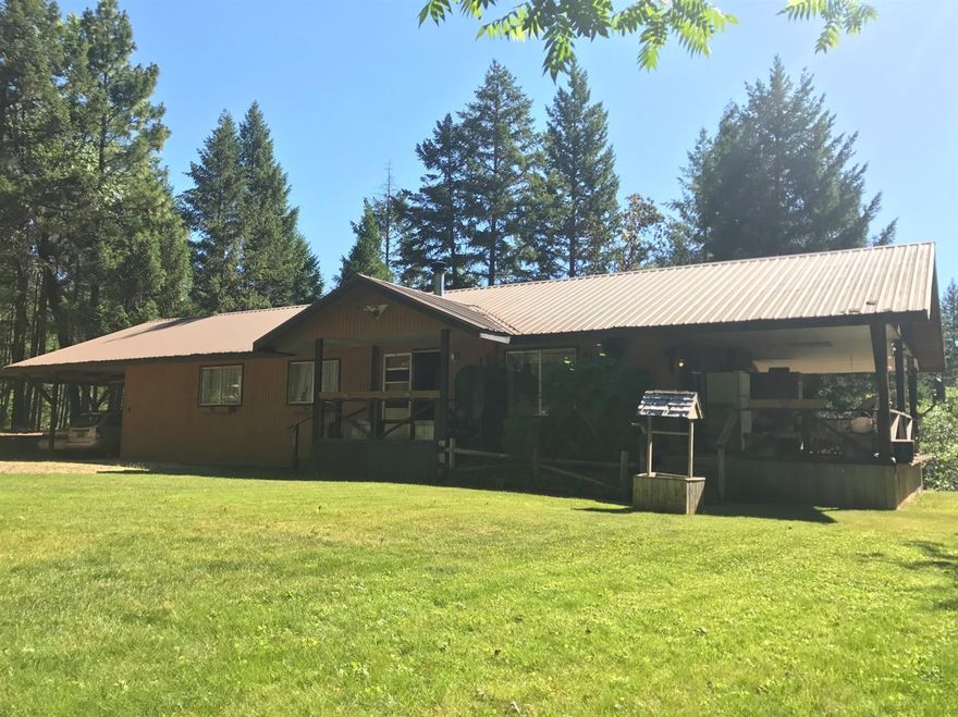 When you see this home you will not believe it's a double wide manufactured home. It has a large deck and a two car carport. WOW! Everything is covered with a metal roof. It's a beautiful drive, just 35 min from G.P. 3 bd. 2 ba with extra large laundry room. Heat source electric oil and wood burning stove. Also has a large shop 24X36X14 with a cement work slab in front, another carport with 3 stalls has a small barn and pasture for horses. Also has a creek that borders the property. A large healthy garden with loads of vegies R.V. parking and much more. All of this on 9 beautiful acres. This is IT, Your own little piece of Oregon. (more photos to come)