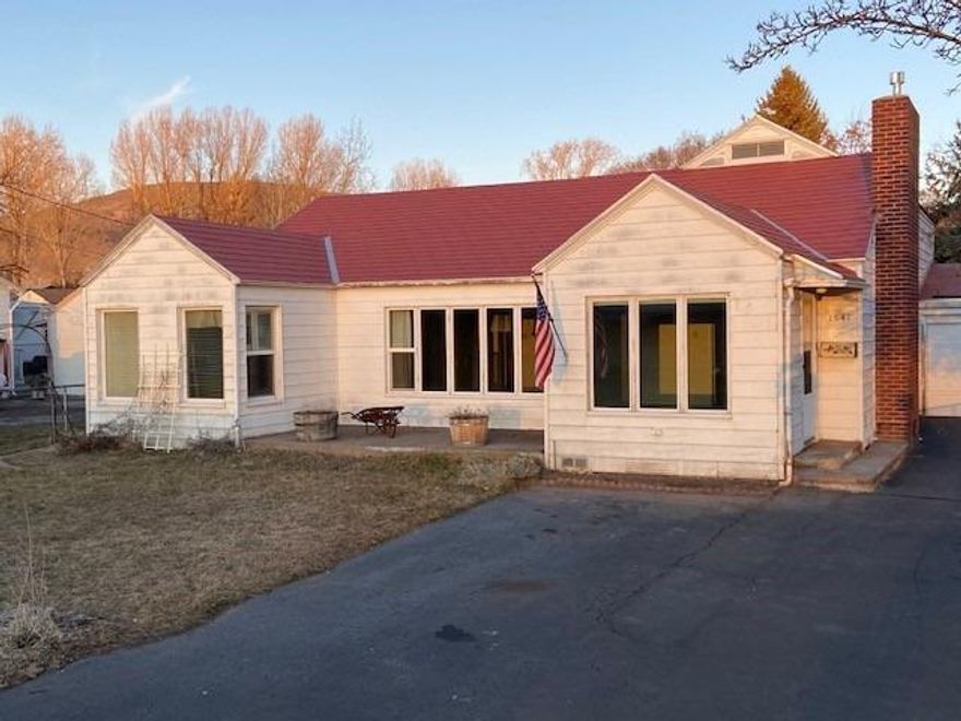 Darling cottage like home perfect fixer of flipper. Home was occupied until recently. Sold AS Is Where Is. Spacious floor plan with 3rd bedroom and extra sitting room or playroom attached. Has lots of 1930's charm in nooks and crannys. Lots of light from abundant window. Some beautiful wood floors. Large living room dining combo. Cute kitchen with breakfast nook. Was gorgeous yard and patio until owner unable to care for it.