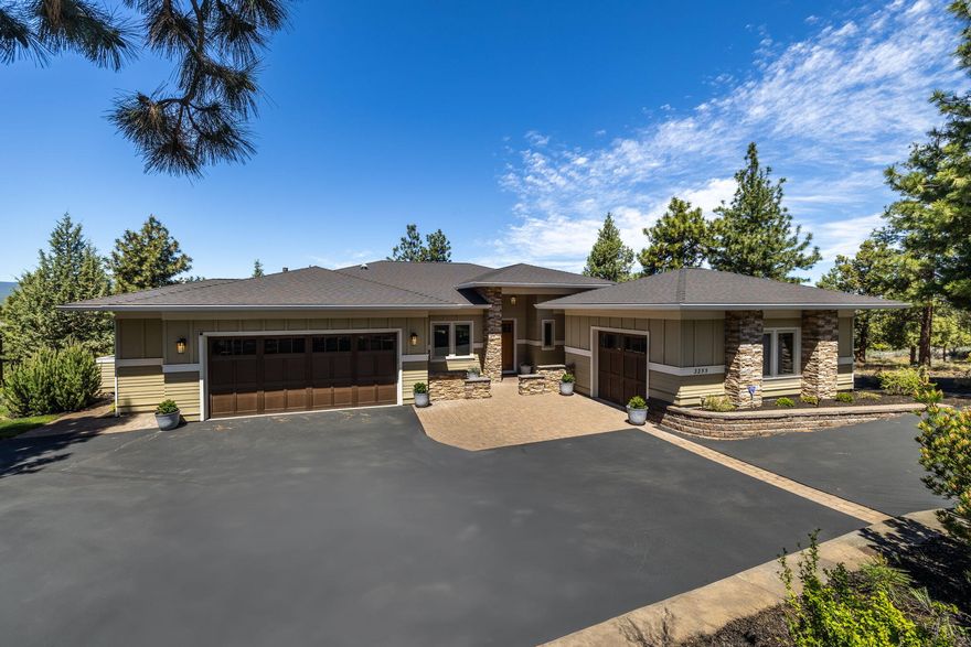 Enter this stunning single level home and experience the splendor of the majestic Cascade Mountains. Home features Birch hardwood floors and tons of Alder cabinets in the spacious kitchen with island. The layout includes Jack and Jill bedrooms separated from the primary providing privacy for family and guests. Additionally, his and her closets in the primary offer ample storage. Marvel at the unparalleled views through triple paned windows. Control the natural light with an electric sunshade in the great room and immerse yourself in entertainment with surround sound throughout the home. Amenities continue with a central vacuum system, a security system and heated floors in the bathrooms. Step onto the covered deck with heaters and ceiling fan and sit in tranquility while viewing the mountains or venture onto the expansive stone paved patio and gather around the gas/wood firepit. Earth Advantage silver certification reflects its commitment to sustainability and efficiency.