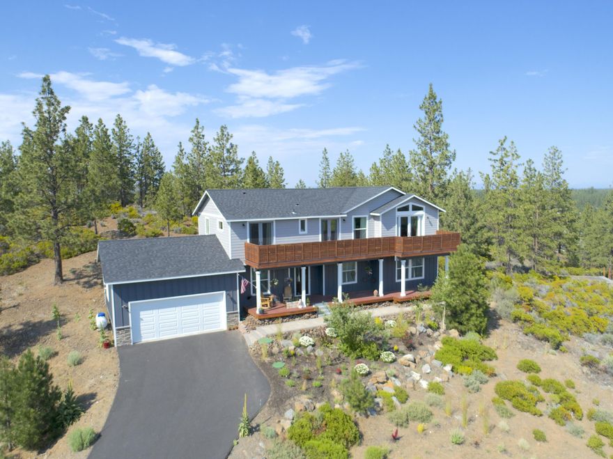 Beautiful move in ready home with space for everyone!  With three bedrooms PLUS an office and over an acre of property, this home has the space and privacy you are looking for!  The expansive forested views from your front deck are the perfect spot to sip your morning coffee.  The great room with floor to ceiling stone gas fireplace has wonderful natural lighting.  The uphill driveway has you sitting above and enjoying exceptional privacy and views!  This well maintained home has an automatic drip system, heat tape on the north side of the home, automatic exterior lighting, and central AC. Six miles to the Old Mill District, yet feels like you are in your own private oasis.  Live like you are on vacation all the time!