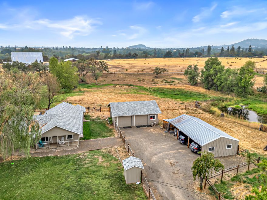 Your remodeled country home awaits. This charming 3-bed residence offers a perfect blend of modern comfort and rural serenity. The heart of the home is the stunning, newly remodeled kitchen, featuring contemporary cabinetry, sleek countertops, and brand-new appliances, perfect for the home chef. The bathroom has also been tastefully updated with modern fixtures and a stylish vanity. Throughout the home, new flooring creates a fresh, cohesive feel. The expansive 2.64-acre property is a true gem, designed for both function and recreation. Your large shop is heated / cooled with a new/efficient ductless HVAC. With fencing and cross-fencing, it's ideal for horses or other livestock. The property also boasts valuable irrigation rights, ensuring lush pastures and a vibrant garden. Enjoy the peaceful surroundings and stunning views from your own private oasis. This turnkey property is a rare find, offering endless possibilities for hobby farming, gardening, and enjoying the great outdoors.