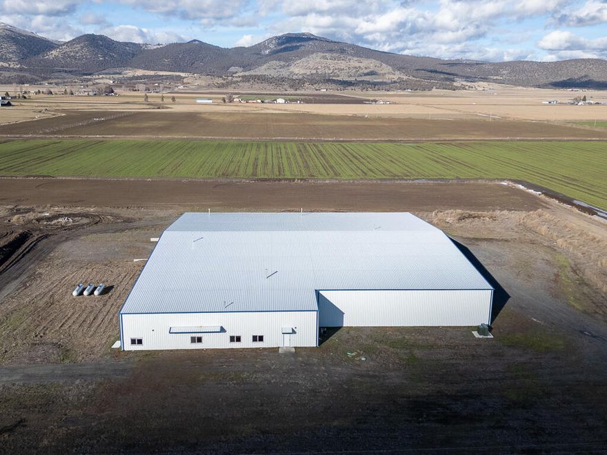Opportunity to own a 42,612 SF warehouse on 5 acres in Merrill, Oregon.  The building was constructed in 2014 and was used for processing and packaging potatoes. There is a +/-4,650 SF cold storage area, an onsite wastewater collection pond and office space.  There is city water and onsite septic system. The office space has individual offices, LED lighting in office area and warehouse, HVAC system, private and public restrooms and reception area.  The warehouse has sealed concrete floors, large drain, 7 doors with 6 grade level and 1 dock high door plus suspended heaters.  
There is Three Phase Power with 1600 AMP 480 Volt Main Service.  External walls and roof is metal- with clear height of 20 to 28 feet.  Lots of room for parking- This is a must see to appreciate!!