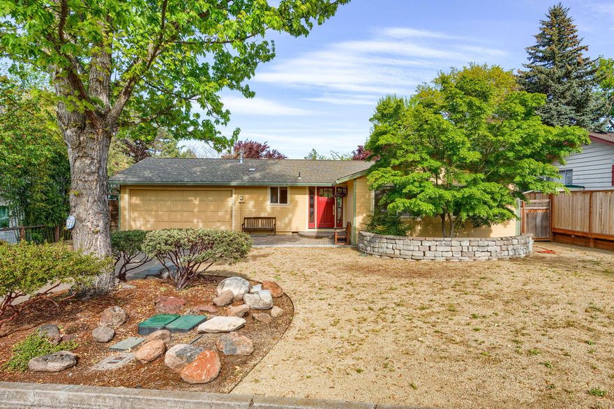 Lovely, single-level home with an excellent in-law or home office floor plan. Sitting on a .2 acre level lot in a quiet neighborhood, this home has been well-cared for and has a fantastic floor plan. One enters an open floor plan with a large living area, eating area, and kitchen. The light-filled space looks out to the landscaped backyard with various mature trees, providing visual interest and shade. French doors lead to an area perfect for in-laws, guests, or a home office. This area includes a family room, a full bathroom, a bedroom, and an office. Three more bedrooms sit on the other side of the house, creating an excellent separation of space. One is a primary suite that overlooks the yard, has an ensuite bath, tile shower, and floors- a lovely retreat. All of this is close to Helman School, the dog park, the Bear Creek Greenway, and just a short jaunt to downtown. This is a fantastic opportunity to enter the Ashland market!