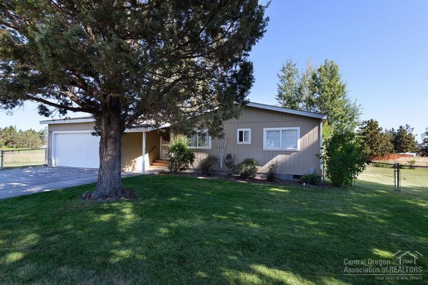 Country living close to everything. Small acreage with 1 acre of irrigation, pond, fenced pasture and yard. The mfg. home is bright and open with vaulted ceilings, sunny breakfast nook, office with built-ins and nice master suite. Double attached garage plus a 570 sq. ft. shop with heat. Located in urban reserve area. Great property with lots of long term potential.