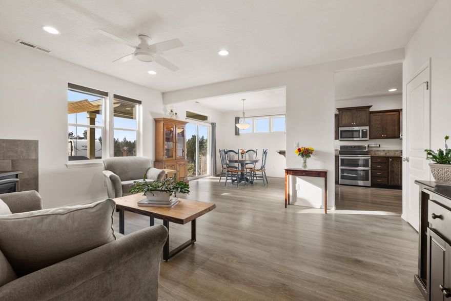 Beautiful Craftsman home in Crooked River Ranch sits on a fenced 1.12 acres. A gated, paved driveway leads you to a 1,926 sf home that boasts lots of windows. A large foyer & wide staircase welcome you into this lovely home. The main floor has a large laundry room with sink, a half bath, the primary bedroom with en suite bathroom has double sinks & a walkin closet, a livingroom with wood stove, a dining room & a kitchen. There are quartz countertops throughout & the kitchen has stainless steel appliances including a refrigerator, double oven & it has a large pantry. The second floor has a sitting room, two bedrooms, one with mountain views, & a bathroom. There are two patios off the back of the home with a hot tub off the primary bedroom's patio. There is a 200 sf insulated shed with sub panel power, heater & window AC.