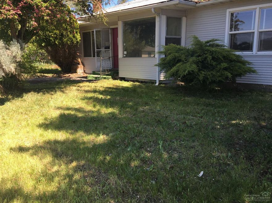 Attention Investors! This quaint little home in the heart of Prineville is ready for some TLC! Great location on fenced corner lot. Home is 1035 sq ft, 2 bd, 1 bth, Vinyl siding, dedicated utility room and large pantry! Detached 2 car garage + shop area + additional storage shed. Lots of room for a big garden! Cash or rehab loans only!