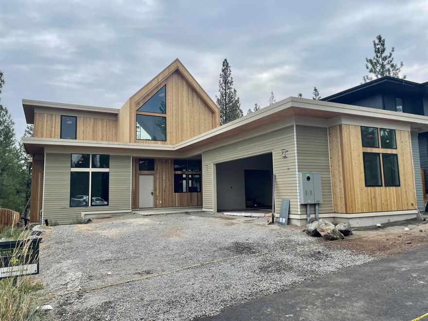 $20,000 Fall Savings Special! Curtis Homes to credit Buyer up to $20,000 for Buyer's closing costs, rate buy-down. Ask us how our preferred lender can provide even more savings. This stunning contemporary design by COBA award-winning Curtis Homes showcases a 2995 sf main house and a 528 sf detached ADU. The main home includes 3 bedrooms, 2.5 baths, an office, a spacious loft, and a primary suite on the main floor. Enjoy the stylish island kitchen equipped with a complete stainless steel appliance package and refrigerator. Custom cabinets, soft-close drawers along with quartz countertops. The spacious open floor plan fosters a seamless flow between spaces. The ADU mirrors the elegance of the main home, offering matching finishes, a delightful kitchen, and a complete appliance package, along with a bedroom and a full bath. The commitment to Earth Advantage energy efficiency standards by Curtis Homes and Outcrop enhances the allure of this residence.