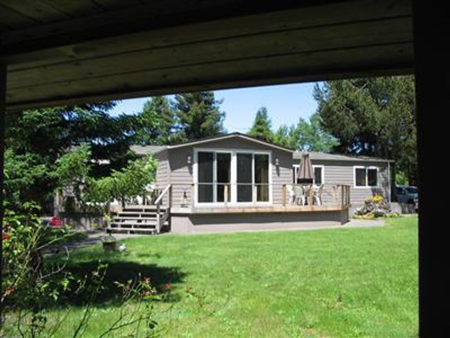 Private setting on the Rogue River. Enjoy the private setting with great views while the park takes care of the grounds. This 2000 sq ft beautifully completely remodeled and upgraded spacious home in 55+ park - set apart from any neighbors, fenced private backyard with access to 3 car garage - shop. Car port and RV parking enhance this resort atmosphere setting-new deck to bar-b-q and enjoy outside living on the Rogue - really must see to appreciate this rare one of a kind opportunity for low maintenance - Beauty enhanced home.