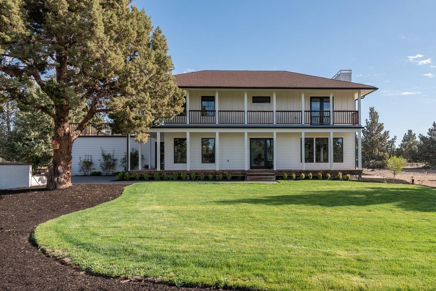 This modern farmhouse will charm you with details and impress you with luxury. Set on 10 private acres, this completely renovated home emphasizes outdoor living with multiple patios and decks and abundant windows for views out to the property. The fabulous kitchen features all Thermador-Pro appliances, quartz island and soap stone counters, custom cabinetry and a walk-in pantry in the stylish mud room. The kitchen opens to the dining room & casual sitting area, perfect for extending meal time, and the living room is the place to unwind. Upstairs is the primary suite with a wrap-around balcony and the luxury bath of your dreams with steam shower, soaking tub, and a beautiful double vanity. 2 additional bedrooms upstairs share a full bath. The 1500 SF shop has 4 garage bays, including 2 oversized doors for RVs or boats, mezzanine storage and more. A private lava tube on the property is truly a geologic wonder and hidden treasure.