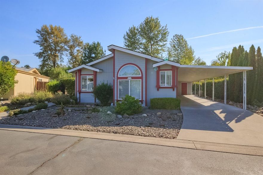 Beautifully appointed 1995 Silvercrest manufactured home located in the desirable Creekside Estates 55+ park. This lovely 1,674 sq. ft. home boasts two bedrooms & an office/den, and two full baths, arched doorways, cutouts, vaulted ceiling. Spacious island kitchen with baking center, & eat-in breakfast nook. Living room with beautiful laminate floors, formal dining room. Large master bedroom has room for your king-sized furniture, two closets, vaulted ceiling, master bathroom with double sink vanity, soaking tub, & separate shower. Covered carport with room for two cars. Easy care, low maintenance yard, covered patio, private backyard.