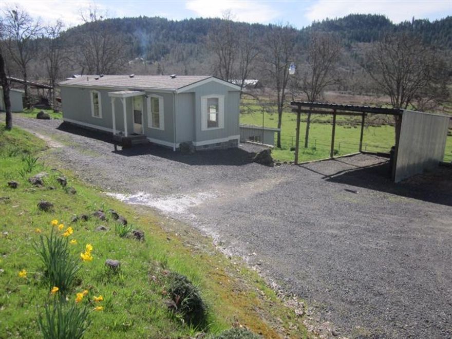 Gorgeous 9.9 acres of pasture land, (3.4 of which are irrigated,) nestled in Oregon's beautiful rolling hills! Plenty of water and fabulous views adorn this desirable location. Enjoy all the joys and benefits of McNeil Creek, which runs through the property. Situated on the land is a nice pole barn. The pasture is fenced and cross fenced and would make for the perfect 4-H or FFA set up! Cozy 1992, 2 bedroom, 1 bath manufactured home with new laminate floors welcomes you and/or your small family. Sit outside and enjoy the amazing views from the large, new deck that overlooks your own private valley!