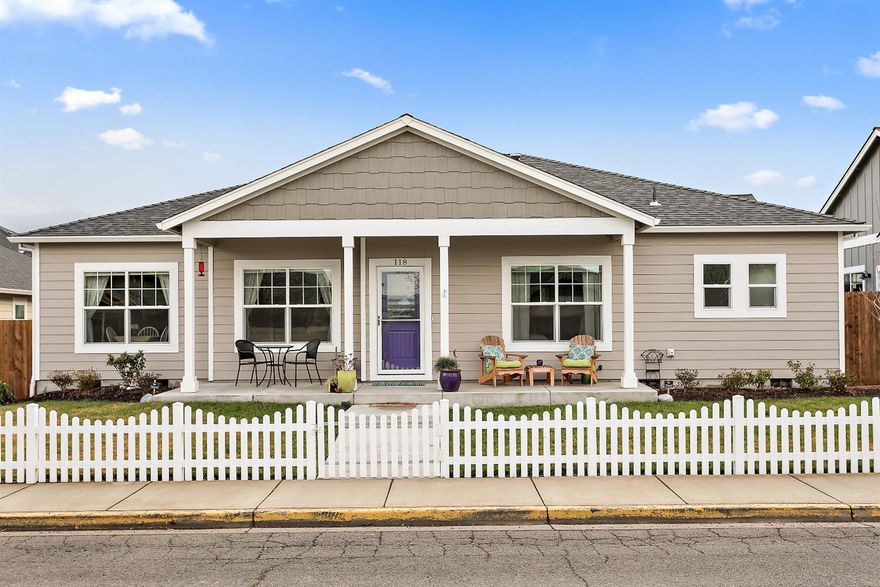 Beautiful single-level home in great Talent location. Built in 2016, this 3 bedroom and 2 bathroom home has a wonderful and open floor plan. With 9' ceilings, the sense of spaciousness feels beyond the 1492 sf. The kitchen features Samsung stainless steel appliances, granite counter tops, large island and high-end cabinetry with pull out drawers in cabinets. A dry bar off the kitchen is an added bonus. Beautiful wood laminate floors throughout the living space adds to open flow of the home. The large master suite has an ensuite bath with dual vanities and a large walk-in closet. Outside, one finds a covered porch that looks over the well manicured front yard that is organic and chemical free. Home is also close to the popular Bear Creek Greenway bike path. All of this in a friendly neighborhood in a great location. Don't miss your opportunity to see this home.