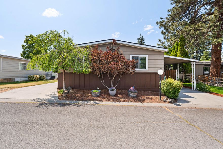 3 MONTHS SPACE RENT CREDIT TO NEW OWNER—making this home an even better value! With three parking spaces—two of them covered—a privacy gate, and tons of closed/covered storage, this property is as practical as it is charming. Inside, you'll find fresh interior paint, updated carpet, and a newer roof for peace of mind. The spacious layout includes a generous primary bedroom with ample closet space and a private en suite bath. All appliances, including the washer and dryer, are included—and select furniture will stay to make your move even easier. The beautifully landscaped yard and fully fenced backyard create a private retreat, complete with a covered back deck perfect for relaxing or entertaining. Located just minutes from Larkspur Community Center, parks, and shopping, this home offers unbeatable convenience. Clean, well-maintained, and ready to welcome you home!