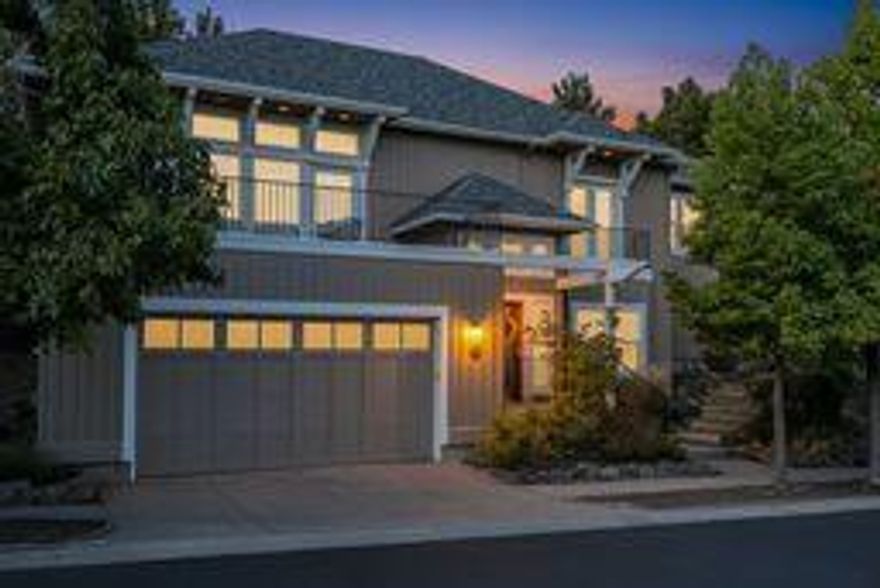 Tucked away on a private street overlooking the Deschutes River in NW Bend, this light and bright 4 bedroom, 4 bath home is the perfect Bend escape. The 2497 SF home offers one bedroom and full bathroom on the entry level, then up one flight of stairs is the large, open great room with a wall of windows, a cozy gas fireplace, an updated kitchen and beautiful hardwood floors. The great room has doors to both the roof deck over the front of the home with river, pilot butte and tree top views as well as the private, covered back patio and nicely landscaped yard. The primary bedroom/bath is down a hallway on the other side of the home, along with two other guest rooms/bathrooms, currently being used as an office and a TV room/den.  From the brand NEW ROOF and FURNACE, to the fresh interior updates, this thoughtfully maintained home is ready for it's next chapter