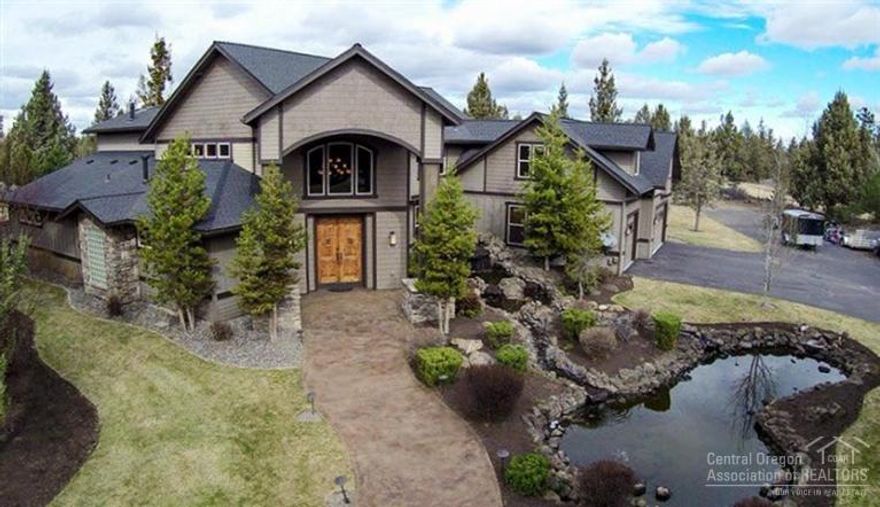 NE Craftsman estate w/Mountain Views on 2.5+ acres of prime edge of town'' property. A waterfall & pond welcome you home! Grand two story, gallery entry w/sweeping Hickory stairway. Natural finishes throughout w/Hickory flrs, Granite, Slate, Marble & Hardwood. Unique accents, art niches, designer lighting. Mstr Ste w/fp, soaker tub, tile shower & sauna. All br's on main level. Theater & bonus rooms on upper. Chef's kitchen w/comm. grade appliances designed for entertaining. Private entry to office/studio.