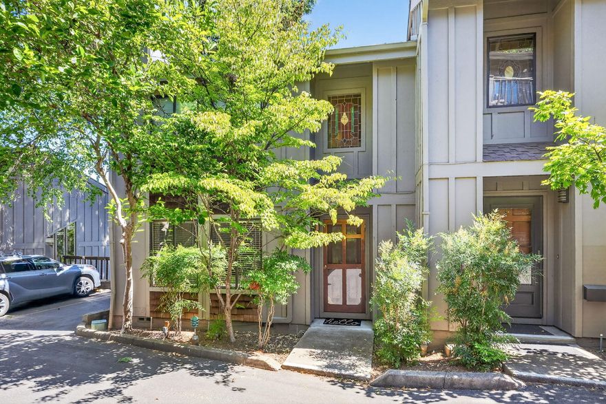 Enjoy the best of Ashland living in this fantastic end-unit townhome at Ravenwood, just blocks from downtown's shops, restaurants, OSF, and Lithia Park. With views of Grizzly Peak and a flexible, light-filled layout, this home is designed for easy, low-maintenance living. The inviting living room offers a cozy gas fireplace and built-ins, while the kitchen and dining area flow perfectly for gatherings. A bonus family room opens to a serene deck— ideal for relaxing or entertaining. Upstairs, two vaulted ceiling bedrooms feature a spacious primary suite with a walk-in closet and a private balcony, offering a stunning view. Covered parking with storage adds convenience. HOA amenities include a pool, landscaping, exterior maintenance, water (interior and exterior water usage), sewer, and trash/recycle removal— a fantastic opportunity to enjoy a vibrant Ashland lifestyle with comfort and ease.