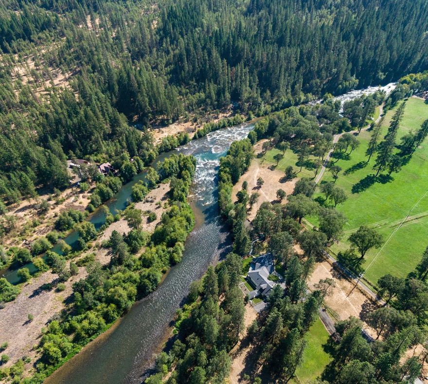 Stunning Rogue River frontage home on the section of the Rogue called Steelhead Alley. Impeccable, almost 4,000 sq. ft. Craftsman home designed to showcase the river & beautiful surrounding views. Stunning single level home with bonus room over 3-car attached garage. Some of the homes features include white oak floors, 10-ft vaulted ceilings, solid pine interior doors & office. The large gourmet kitchen has granite counters, large island with prep/sink, double wall ovens, 6-burner gas cook top & walk-in pantry. Dining & living room has wall of windows. Attractive master suite has views from every window, travertine tile, large soaking tub, separate shower, double sink vanity & walk-in closet. Each bedroom has its own bathroom. This magnificent home comes complete with dual HVAC systems, heated tile flooring, central vac & security system. The outside 3.9-irrigated acres has a 24x50, 2-stall barn with tack & hay storage. Barn has 220 power & plumbed for auto water & RV parking.