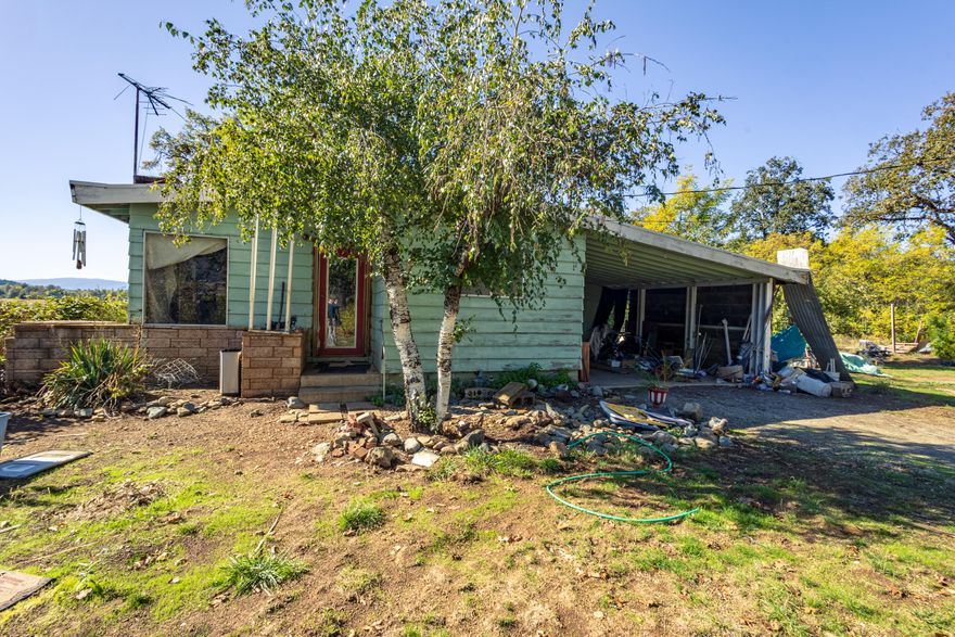 The affordable home you have been looking for! This cottage with a vintage style was built in 1962 and it sits on a .61 acre lot. With 2 beds, 1 bath, and 806 sq ft, your new home offers a large attached carport and amazing views of vineyards and hills. There's a brick fireplace and hardwood floors, it's ready for a remodel to truly shine. Don't miss this opportunity to transform this charming property into your dream home!