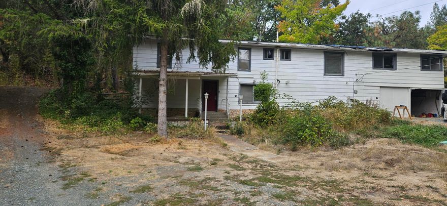 Contractor special. No it won't traditionally finance. Possible finance with a hard money, contractor loan or rehab loan only. No owner carry.
Much has already been done - New Septic and field, new well pump, new flooring upstairs, newer mini split, hot water heater, dishwasher, disposal.
Great location and nice property just outside of town. Use home as huge shop and place a new manufactured or rehab what is there.