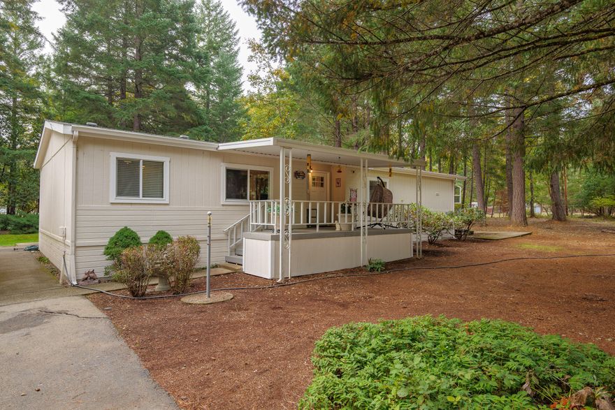 Discover the perfect blend of comfort and country living at 145 Griffin Road in Grants Pass. This beautifully remodeled 3-bedroom, 2-bathroom home sits on 2.5 acres and offers 1,566 square feet of open, light-filled living space. Updates include new flooring, windows, doors, and a freshly painted exterior. The kitchen features tile countertops, while both bathrooms shine with granite and modern finishes—the primary showcasing a double vanity. Outside, enjoy a large garden with a sturdy deer fence, new Tough Shed, chicken coop, outdoor pantry, and new water filtration system. A detached 2-car garage/shop and carport provide plenty of space for parking and projects. A move-in ready property designed for relaxed rural living close to town.
