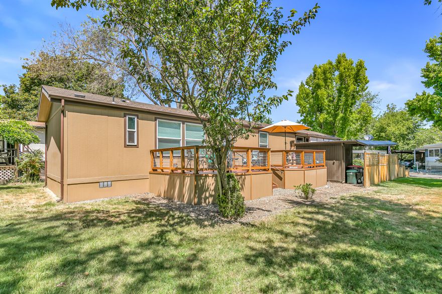 BACK ON THE MARKET, at no fault of the property. Recent appraisal confirming it's value. Your dream home is right here in the charming historic town of Jacksonville! This beautiful 1,178 sqft manufactured home, built in 2022, boasts 3 bedrooms and 2 modern bathrooms. Step outside to an impressive 352 sqft custom Trex redwood deck that offers peaceful, unobstructed park-like views, partially surrounded by a beautifully crafted cedar fence and an expanded driveway for added convenience. 
The open floor plan invites you in, creating a warm and welcoming atmosphere, while the kitchen features elegant walnut cabinetry and plenty of storage both inside and out. This is a fantastic opportunity to own a slice of Jacksonville's unique charm—don't let it pass you by!