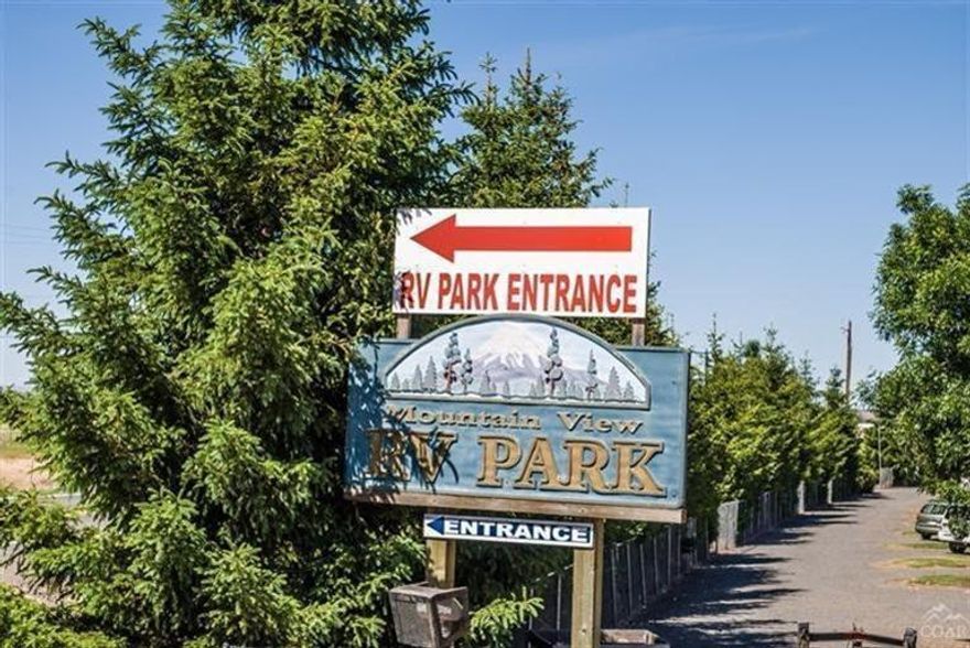 Consistant high occupancy park. This lovely park is comprised of 6+ gorgeous acres that is close to lakes, casino, mountains & recreation, yet minutes to town. 69 RV spaces with 40+ full time. Solid repeat clients. Immaculate remodeled double wide for owner/mngr. Coin-op laundry, office, 5 large storage units. Full list of equipment available. Owner will consider terms. View of cascades.