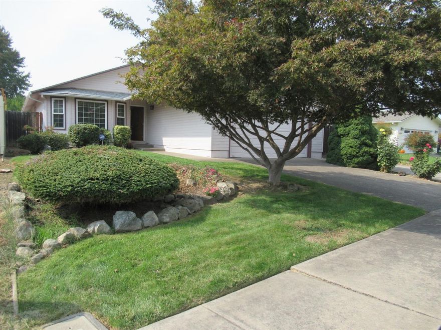 Great family area! This 3 bed 2 bath is located in a quiet neighborhood of Central Point. Kitchen/Dining has newer appliances. Large living room w/vaulted ceilings & bay window. Skylight in bathroom. RV parking w/hookups, and can easily fit two RV/s. Very large back yard w/ beautiful Roses and automatic sprinkler system. Roof is a couple of years old, new AC, washer & dryer included in the sale, only 2 years old. Inside of house will be freshly painted before close of escrow and Seller will provide allowance for new carpeting.