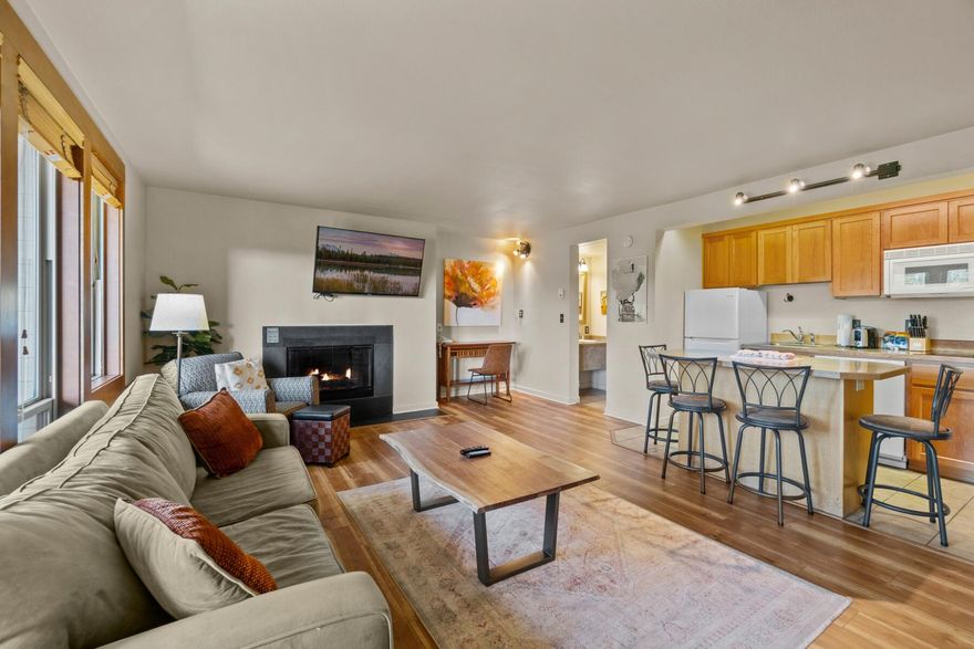 A charming one bedroom, two bath vacation home at Seventh Mountain Resort, ready for you to start making memories. Here, a spacious and open-concept living area features engineered hardwood floors, large windows to the generous back deck, and a cozy fireplace with hearth. The kitchen offers updated appliances, a lovely island, and plenty of storage space. The generous primary suite is perfect for relaxing after a long day of recreating, and the unit also includes a Murphy bed and pull-out couch to sleep 6 adults comfortably. Enjoy gorgeous views of the surrounding scenery from the comfort of your own balcony. Resort amenities include multiple heated outdoor pools and hot tubs, fire pits, mini golf, fitness center, restaurant, a BBQ area, and direct hiking access straight from the property. In the winter, enjoy ice skating onsite and the summer means whitewater rafting, on-site stables for horseback riding and so much more. Not to be missed!