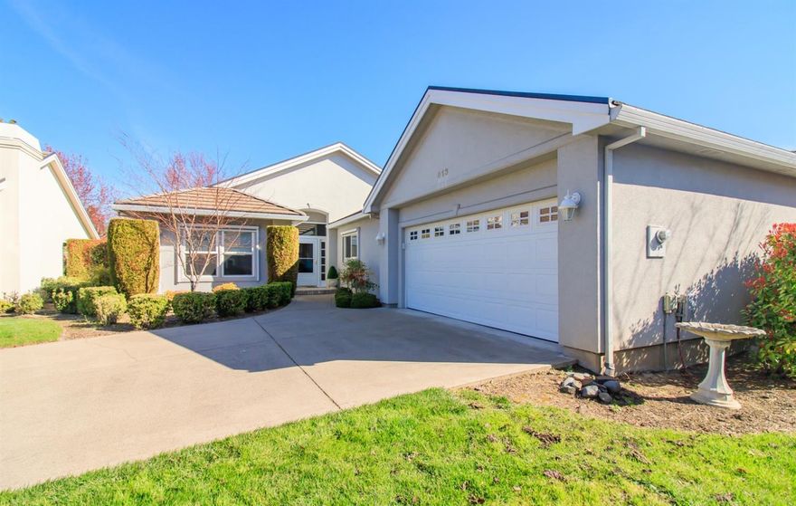 Pride of ownership shows throughout home. This home is located in the desirable Alder Creek gated community with a light & bright open floor plan and move-in ready! Vaulted ceilings, plant shelves throughout, & a warm and cozy gas fireplace. Split bedroom floor plan with french doors opening to the large master suite and a master bath with skylights and a his and hers large walk-in closet. Home features newer appliances and inside paint. Private covered patio along the entire back of home with access from living room and kitchen. Generous 2-car garage and nice sized laundry room with sink and storage. HOA fees are $180.00 which covers landscaping including water, street and gate maintenance.