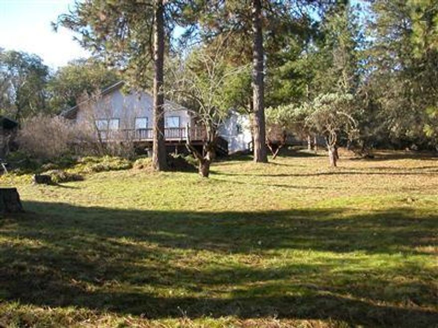 4.6 acre residential development property in Jacksonville city limits zoned for 1/2 acre lots. Property is flat to sloping with views of the valley and surrounding mountains. The existing house has 1457 sq. ft. of living space with 2 bedrooms, 2 baths and a 3 car detached garage. The property consists of 3 tax lots totaling approx 4.6 acres.