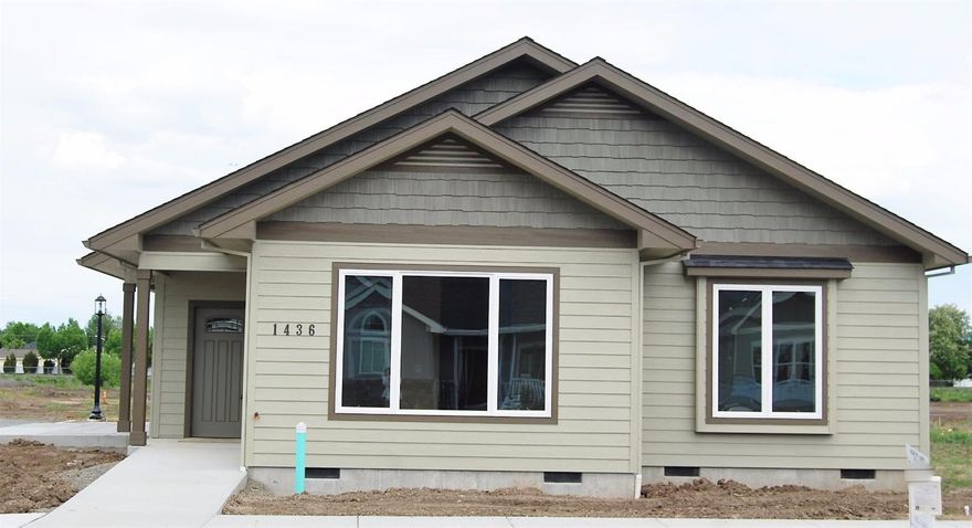 Perfect new single level plan, across the street from a pocket park, built to LIFELONG HOUSING standards and Earth Advantage Platinum certified. Coffered Great Room with ceiling fan. Island kitchen with granite counters, under cabinet lighting, hardwood floor, quality appliances, breakfast bar, walk in pantry. Bright dining space with french door to side patio. Pocket door to utility room w/custom cabinetry. Front bedroom wing w/Coffered Master bedroom, accessible bath with tile floor and no-step shower. Custom walk-in closet.Guest Bedroom wing is at the rear of the house, coffered bedrooms with ceiling fans, custom closets. Alley-loaded Garage is finished with exterior keypad, & pull-down stairs to storage + Bonus shop space + Heat pump water heater! Nice sized yard in this 0-lot line home w/room for garden boxes or cross fencing for pets. Still time to customize landscaping. Listing agent is a principal of selling corporation. Other lots and plans available.