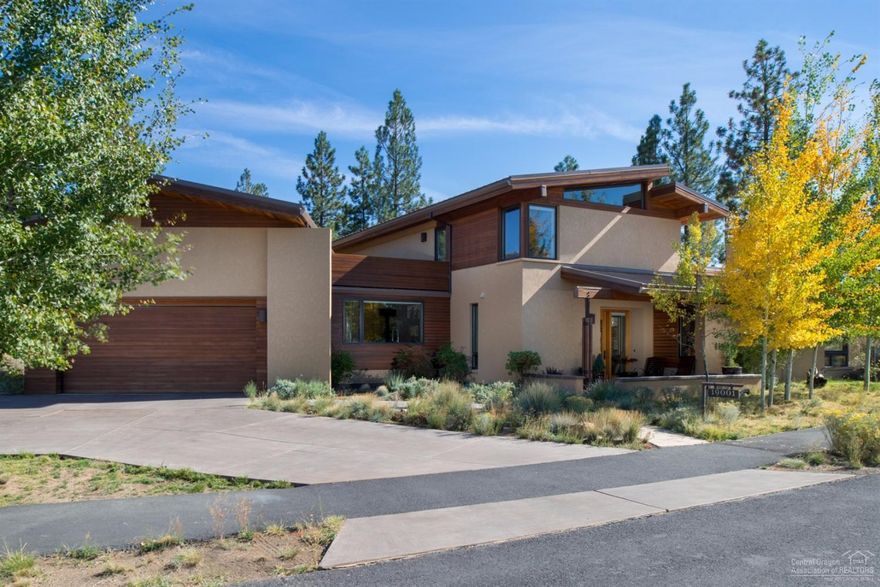 Spectacular contemporary, energy efficient home built w/sustainable resources. Open floor plan, kitchen w/stainless steel appliances, concrete counters, great room w/wood burning fp, office w/sliding barn door, master on main. Modern elements thru-out including wood & steel beams accentuating decked ceilings, slab concrete & fir flooring w/radiant heat. Trex rooftop deck w/peek-a-boo mtn views. Private flagstone courtyard w/built-in bench seating; hot tub area w/outdoor shower; storage room above garage.